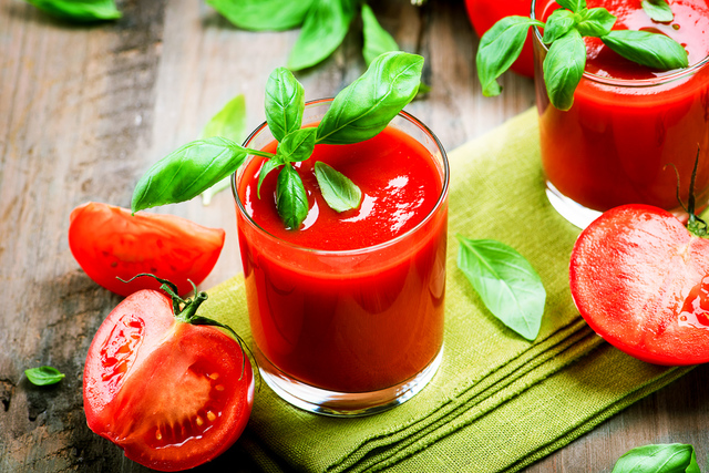 Fresh tomato juice with tomatoes and basil