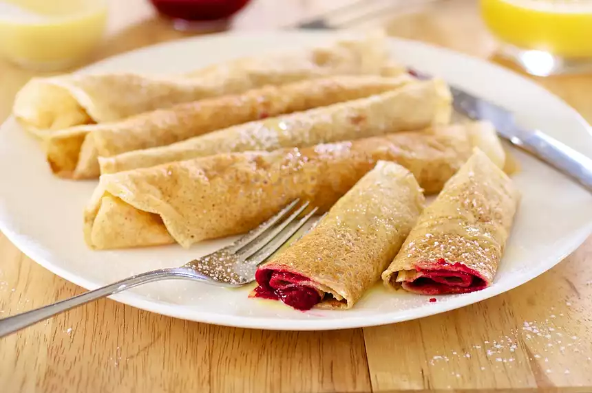 Raspberry Crepes with Creamy Orange Syrup