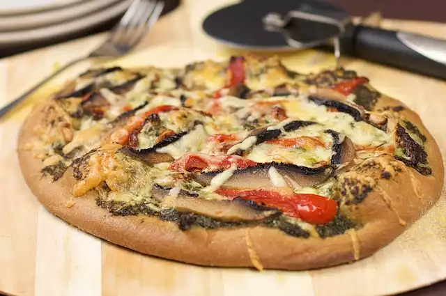 Basil Pesto, Roasted Pepper, Sun-dried Tomatoes and Portabella Mushrooms Pizza